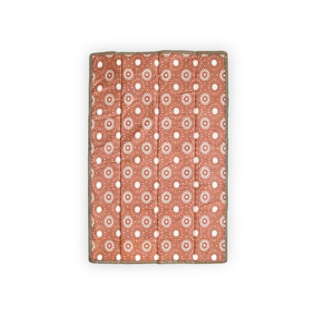Orange blanket with white circular patterns