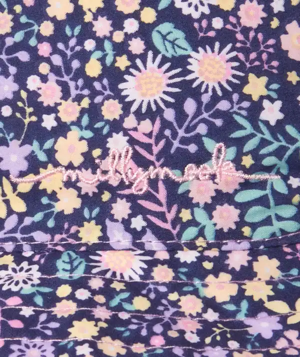 Floral pattern fabric with pink embroidery.