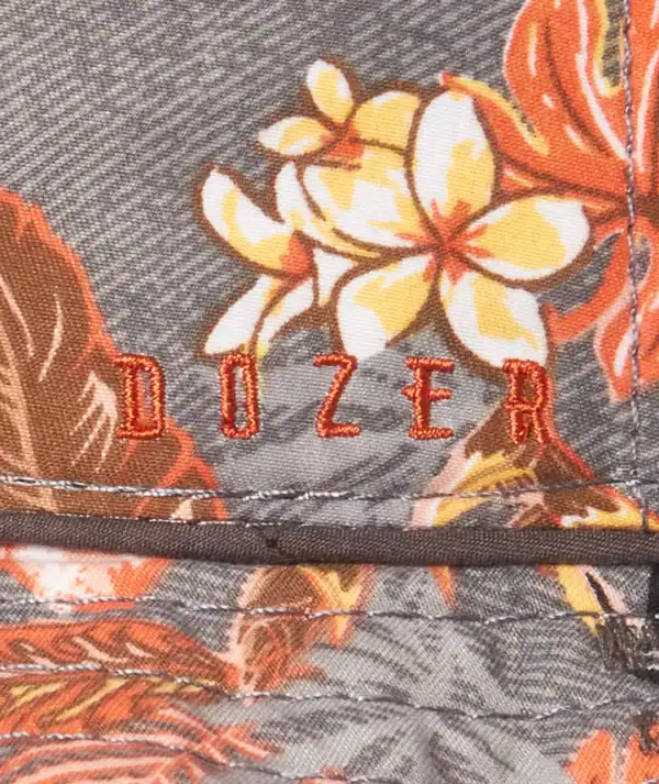 Floral fabric with 'Dozer' embroidered in red.
