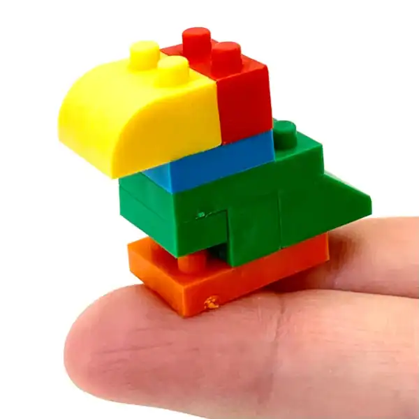 Colorful Lego parrot on a fingertip