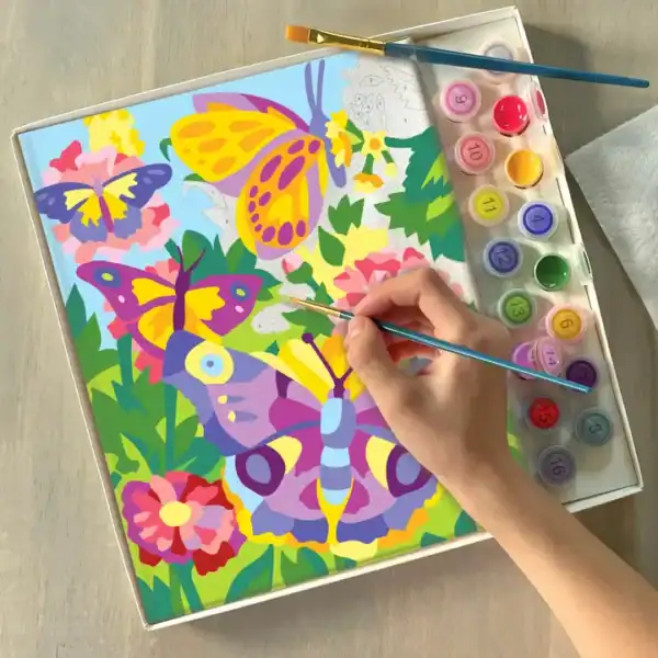 Hand painting colorful butterflies and flowers.