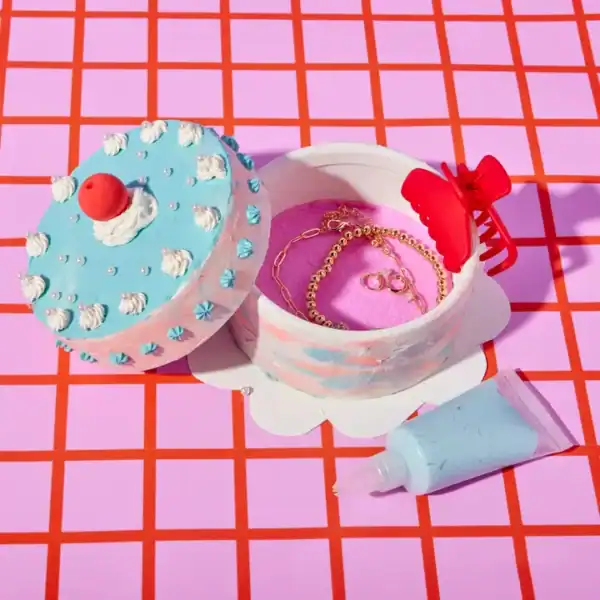 Cake box with jewelry and cream tube
