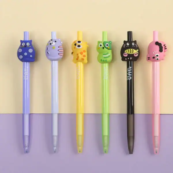 Colorful pens with cute animal toppers in a row.