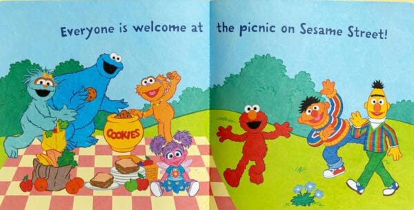Sesame Street characters enjoy a picnic together.