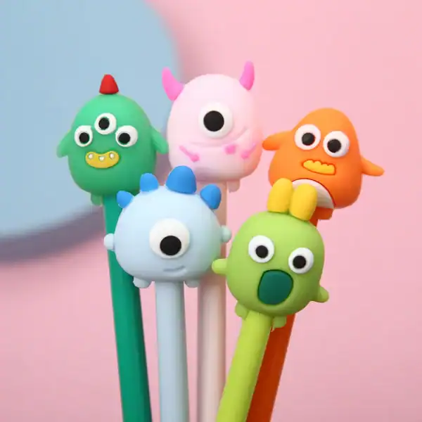 Cute monster-themed pens with colorful designs.