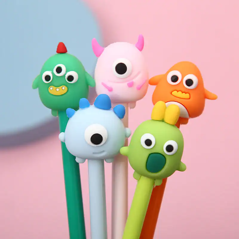 Cute monster-themed pens with colorful designs.