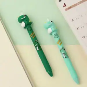 Dinosaur pens on desk with open notebook and calendar.