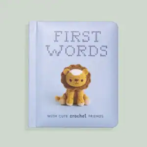 First Words book with crochet lion on cover.