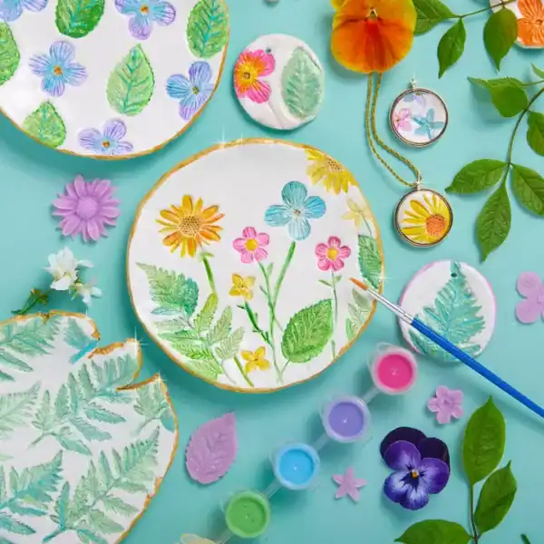 Colorful floral clay crafts and painting supplies
