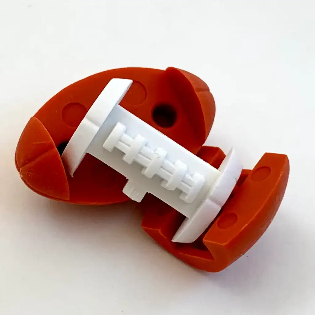Football-shaped cable organizer with white spool