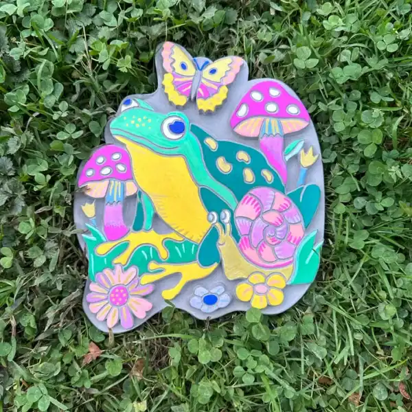 Colorful frog art with mushrooms and butterfly