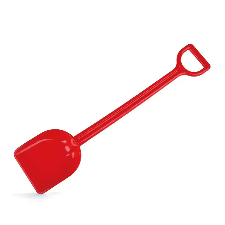 Red plastic toy shovel on white background.