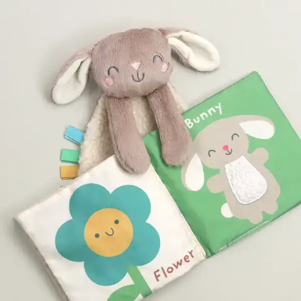 Plush bunny toy with fabric book for babies.