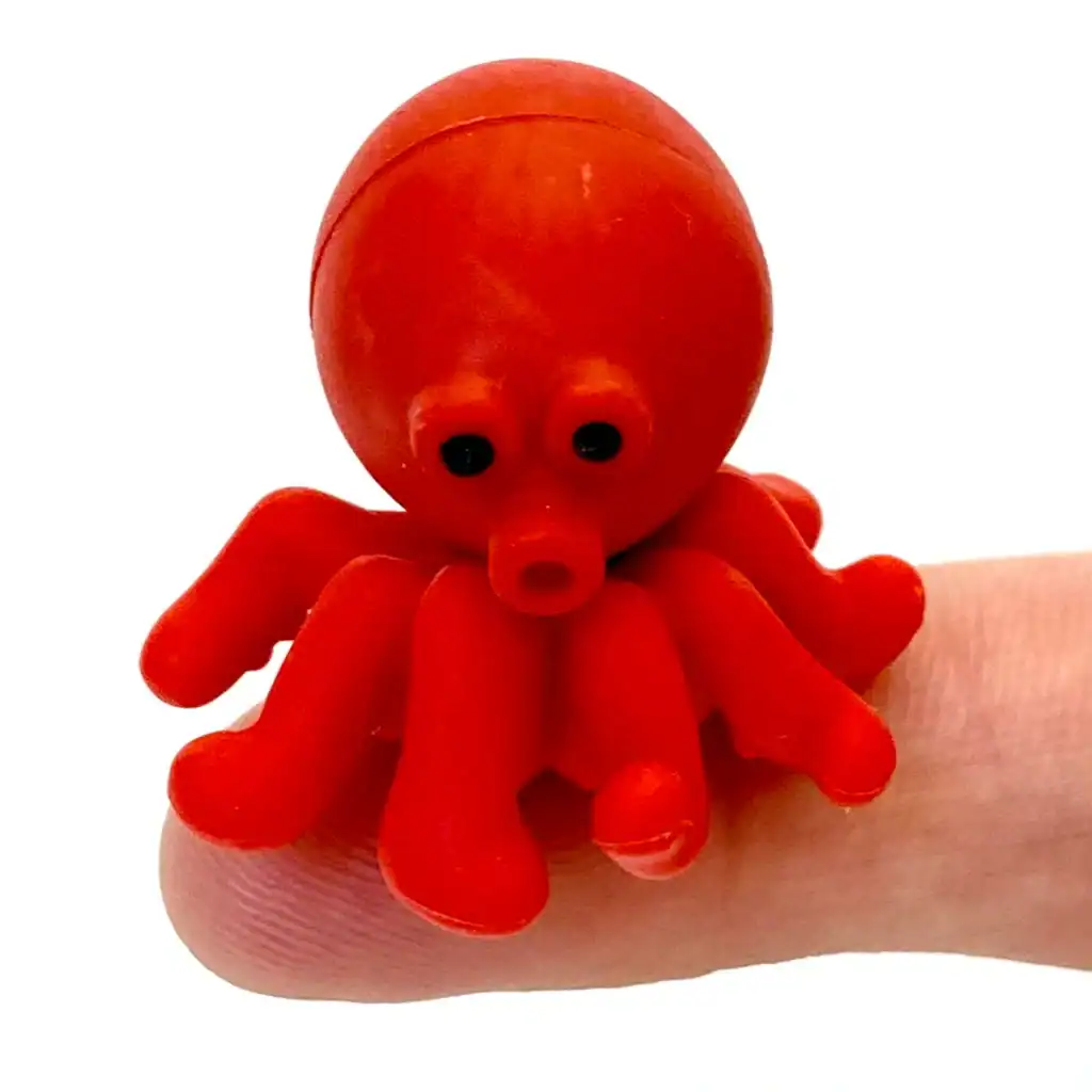 Red toy octopus on a finger