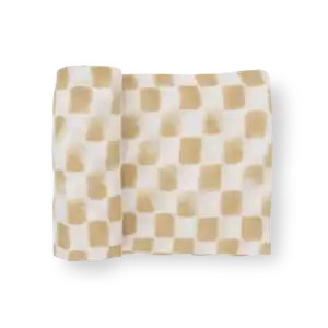 Beige checkered fabric roll on black background