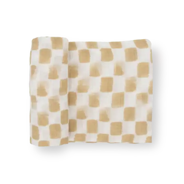 Beige checkered fabric roll on black background