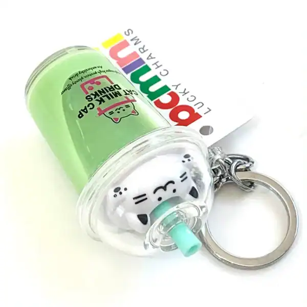 Cat milk cap keychain with green design
