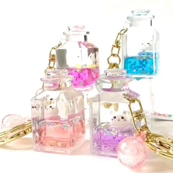 Cute animal keychains in colorful jars with stars.