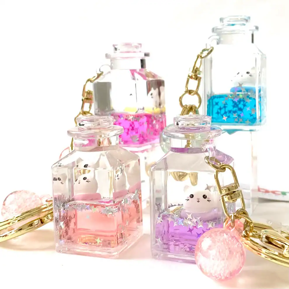 Cute animal keychains in colorful jars with stars.