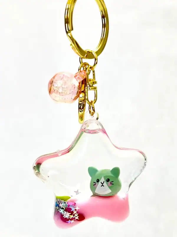 Star-shaped keychain with cute animal design