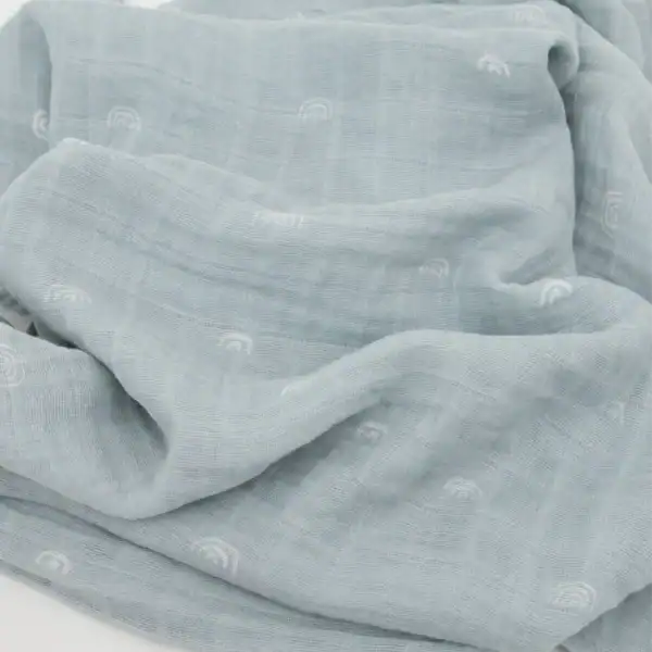 Light blue muslin fabric with subtle rainbow pattern