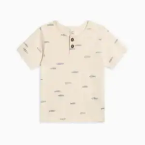 Cream t-shirt with fish pattern and buttons.