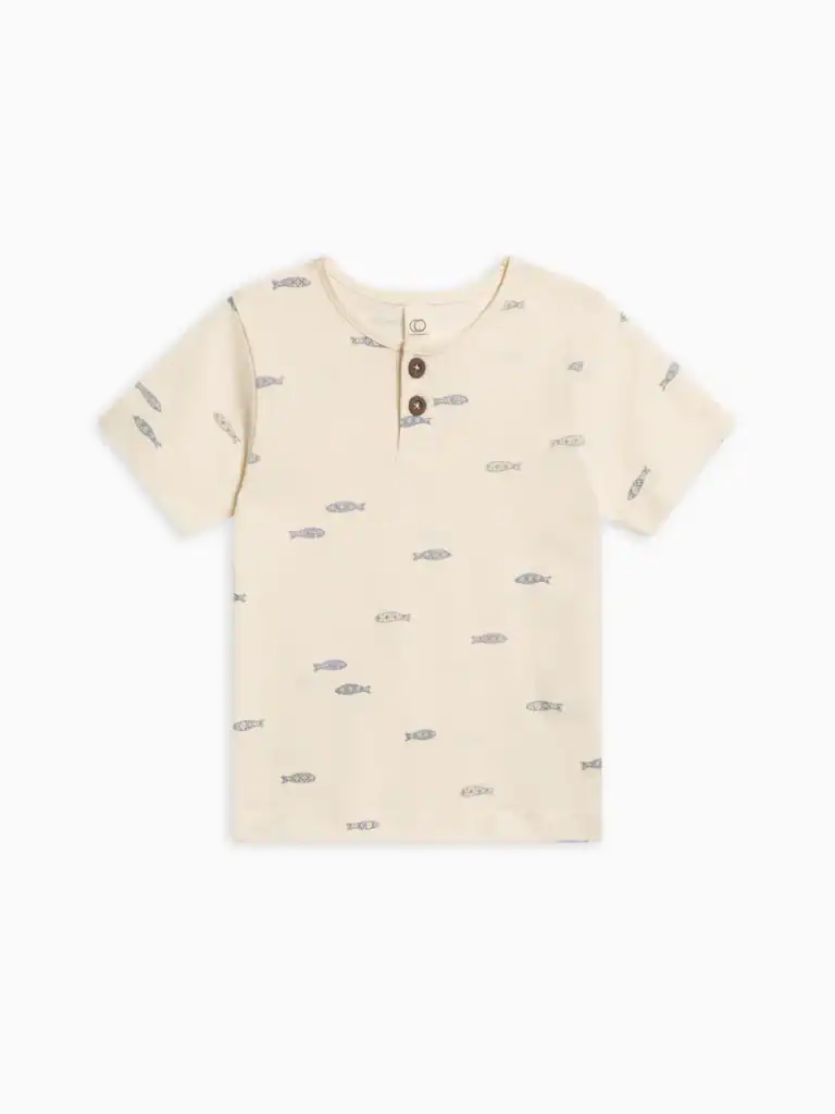 Cream t-shirt with fish pattern and buttons.