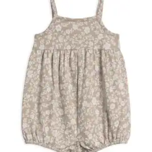 Beige floral baby romper with straps.