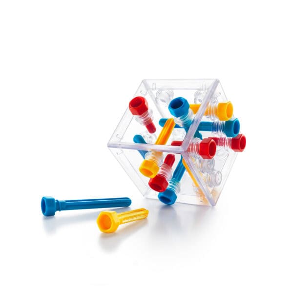 Colorful plastic puzzle pieces in a transparent box.