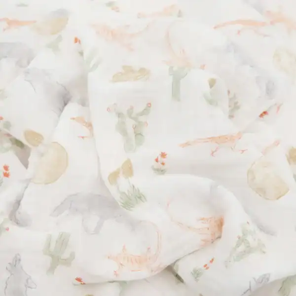 Fabric with desert-themed animal and plant patterns