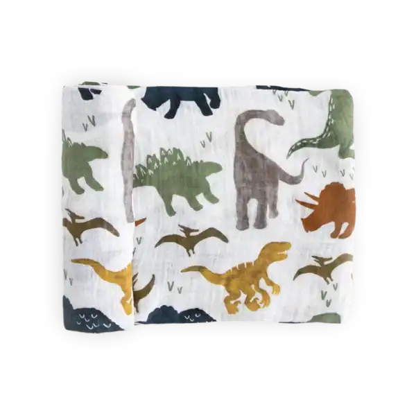 Colorful dinosaur-patterned fabric on black background.