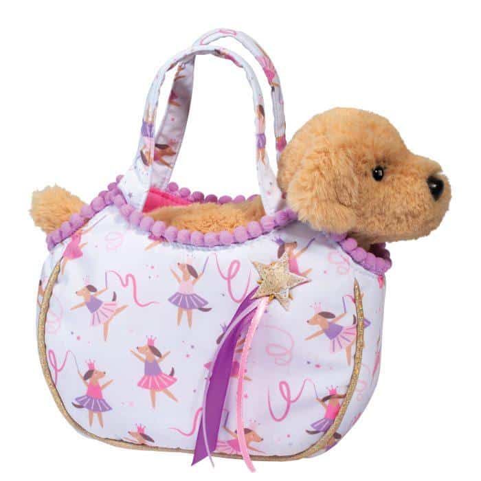 Plush dog in a ballet-themed handbag.