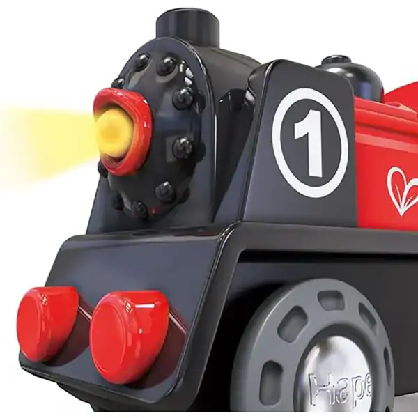 Black and red toy train with light.
