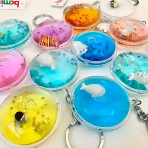 Colorful animal-themed keychains with star glitter inside.