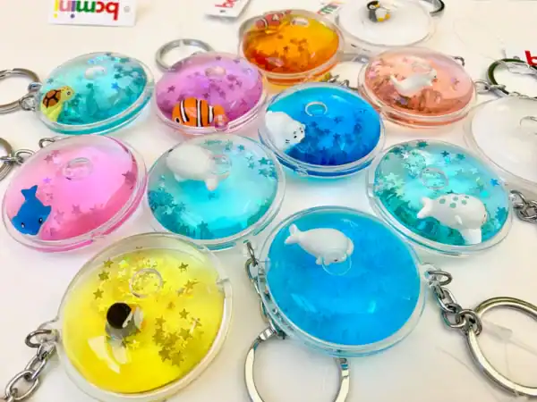 Colorful animal-themed keychains with star glitter inside.