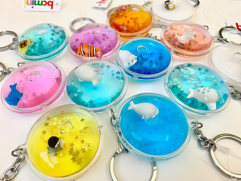 Colorful animal-themed keychains with star glitter inside.