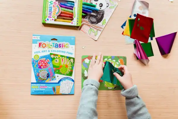 Child using Foil-Tastic coloring kit