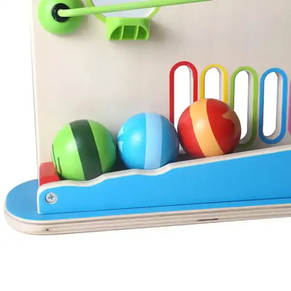 Colorful balls in wooden toy track