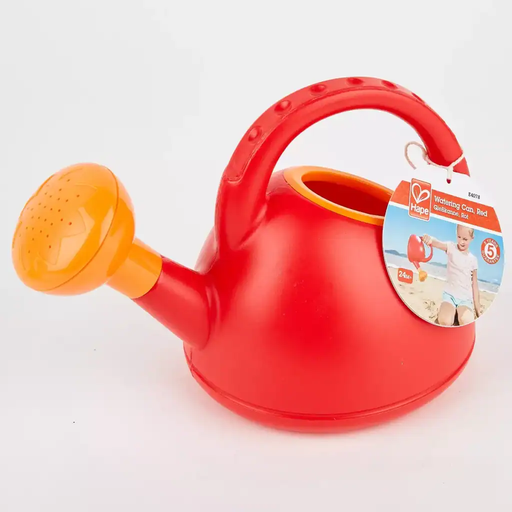 Red children's watering can with label.