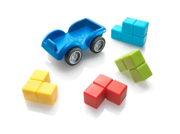 Colorful toy car and blocks on white background.