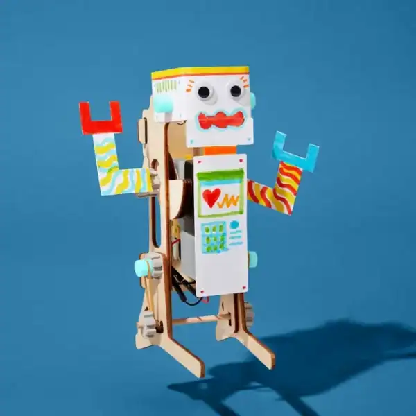 Colorful wooden robot on blue background.