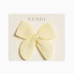 Yellow lace bow on display card