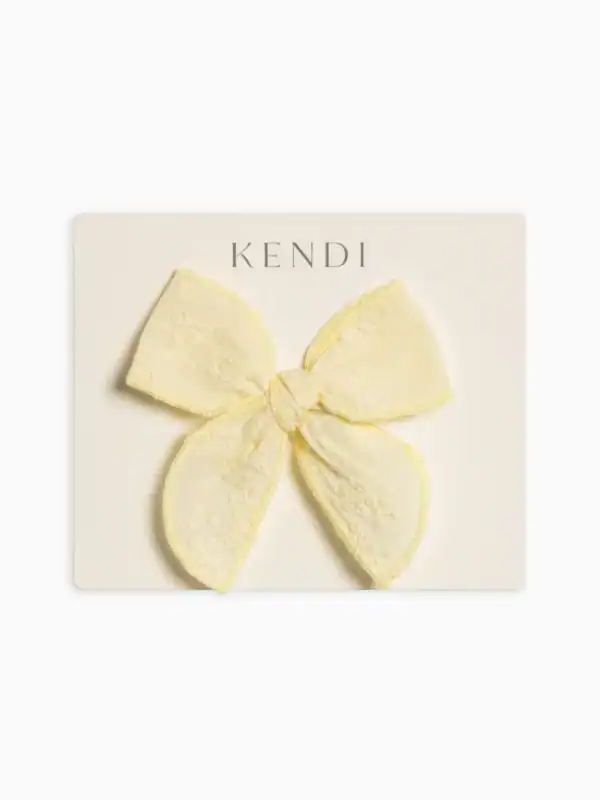 Yellow lace bow on display card