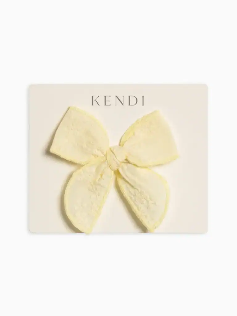Yellow lace bow on display card