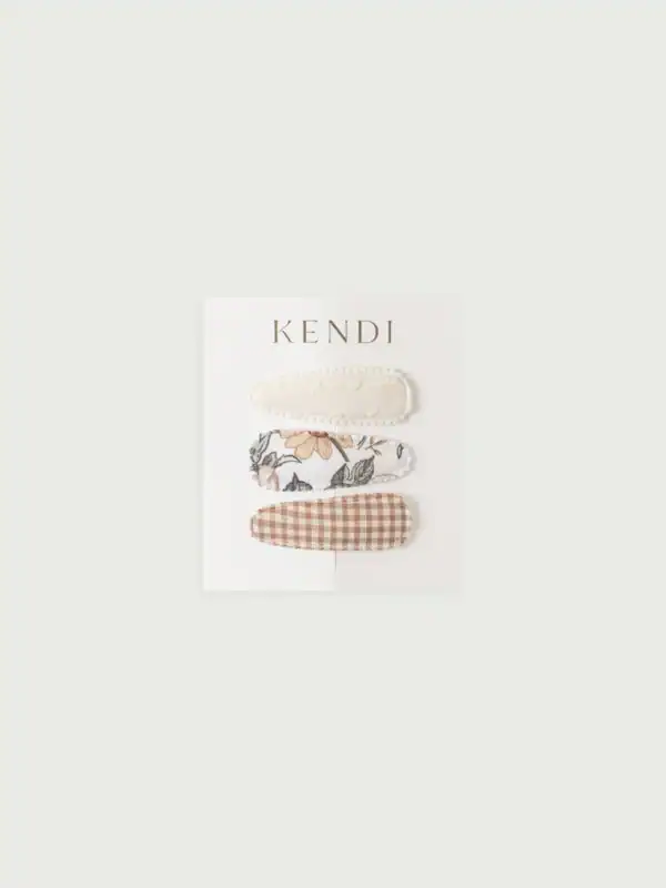 Three decorative hair clips set on card