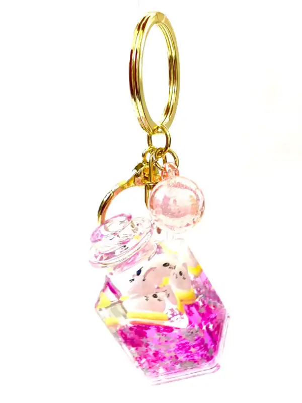 Cute pink glitter keychain with crystal jar design.