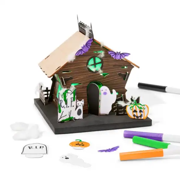 DIY Halloween haunted house craft with decorations.