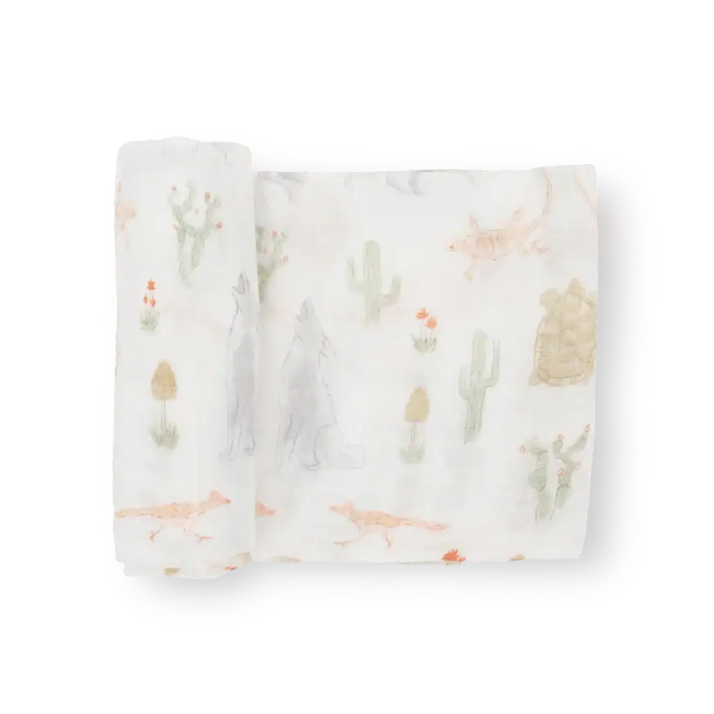 Desert-themed muslin blanket with animal illustrations.