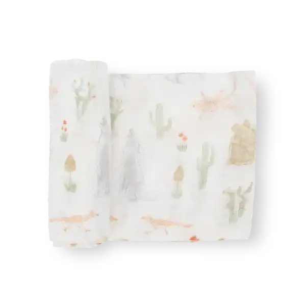 Desert-themed muslin blanket with animal illustrations.