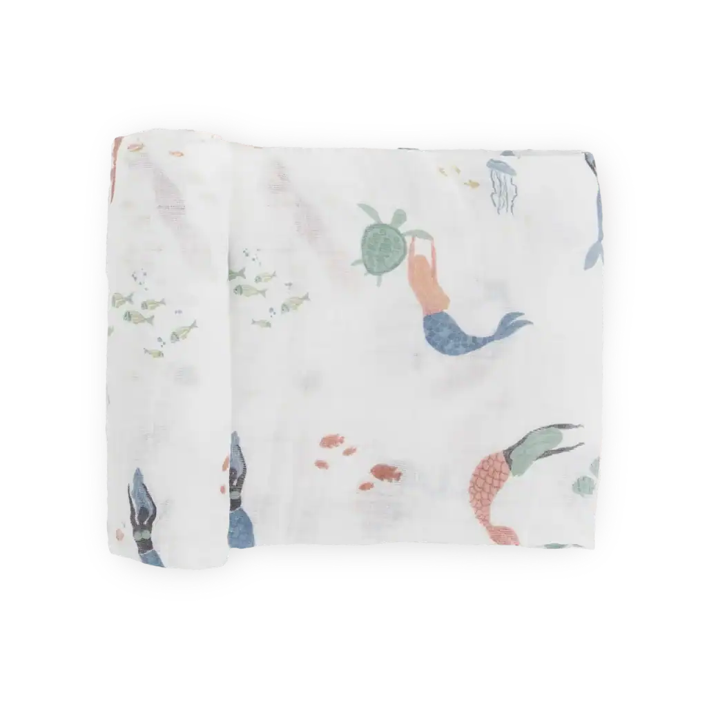 Rolled white fabric with colorful mermaid design